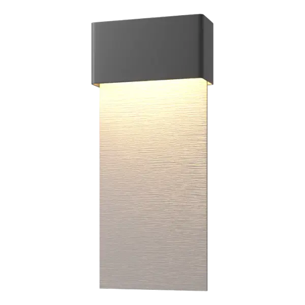 Long in length, the beautifully textured aluminum backplate guides the light downward from the LED illumination, hidden within the header element. Stylish and elegant, the Stratum Dark Sky Friendly Outdoor Sconce features a two-tone finish option. Starlit night skies come into focus with the Stratum, built specifically to reduce light pollution while enhancing the beauty of any exterior.