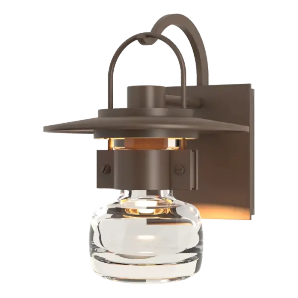 Our steampunk version of a traditional lantern is bold and striking. Our small Mason Outdoor Sconce shows plenty of craftsmanship, from the thick blown glass bell to the metallic curves of support arm and handle, to the details of the riveted collar-this has it all.