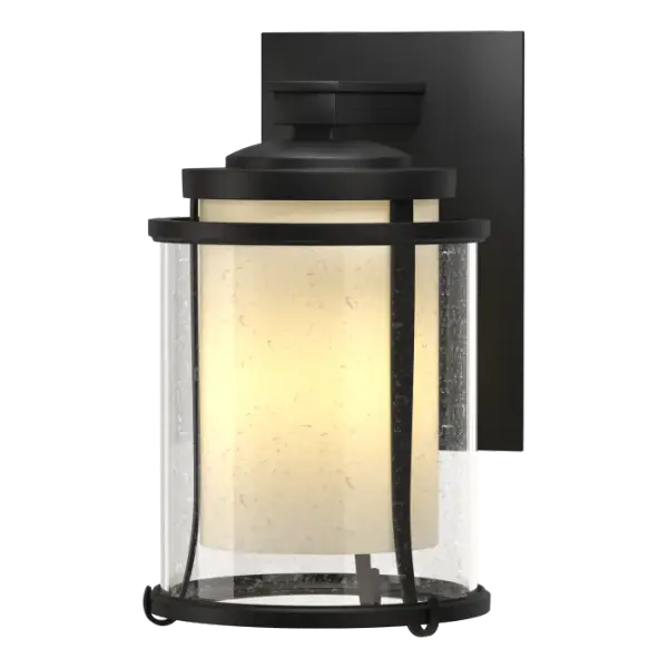 There's something to be said about the welcoming glow of a light on a dark night. Our small, artfully handcrafted Meridian Outdoor Sconce says it well. Metal bands encircle contemporary seeded glass that in turn, surrounds an opaque glass housing the light.