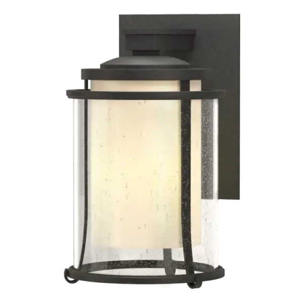 There's something to be said about the welcoming glow of a light on a dark night. Our artfully handcrafted Meridian Outdoor Sconce says it well. Metal bands encircle contemporary seeded glass that in turn, surrounds an opaque glass housing the light.