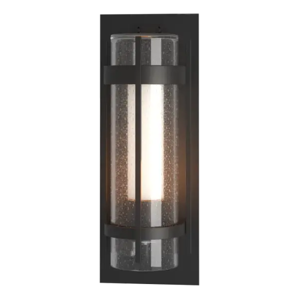 The ever-popular Torch Outdoor Collection puts a contemporary spin on a timeless design, with clear seeded glass cylinder and a frosted inner diffuser. Almost 26" in height, the Torch XL Outdoor Sconce makes a statement as guests are welcomed. Crafted in aluminum, this Torch sconce is offered in any of our robust Coastal Outdoor Finishes. Offered in 4 sizes, from Small to XL.