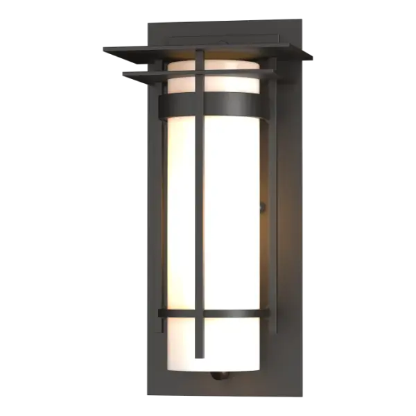 A clean, sleek design that evokes dreams of the Far East are the hallmarks of our Banded Collection. True to name, two handcrafted metal bands, intersected by a bold l-bar, encircle the glass and fasten to the mounting plate with glass tube resting on and capped by metal plates.