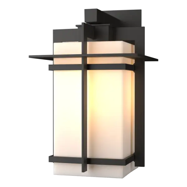 Although the design is in honor of traditional Japanese stone lanterns, our Tourou Outdoor Sconce is much easier to mount on the outside of your home or business. Metals bands crisscross and hug the square glass tube for design flare.