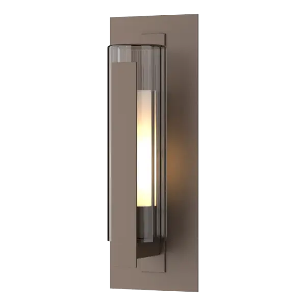 Popular for its simple lines and craftsmanship, the Vertical Bar Outdoor Sconce gets a contemporary update with a double-glass cylinder of clear fluted over opal inner glass, with a simple aluminum bar shielding them. This classic Vertical Bar Medium Outdoor Sconce is offered in HF Coastal Outdoor Finishes.