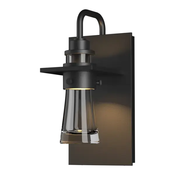 Inspired by the flat-bottomed Erlenmeyer flask, our outdoor sconce provides the catalyst for your design chemistry. The thick, clear blown-glass flask is encircled by a metal collar which is in turn, embedded in a metal plate.