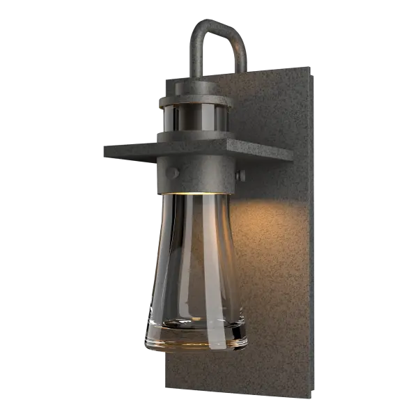 Inspired by the flat-bottomed Erlenmeyer flask, our outdoor sconce provides the catalyst for your design chemistry. The thick, clear blown-glass flask is encircled by a metal collar which is in turn, embedded in a metal plate.