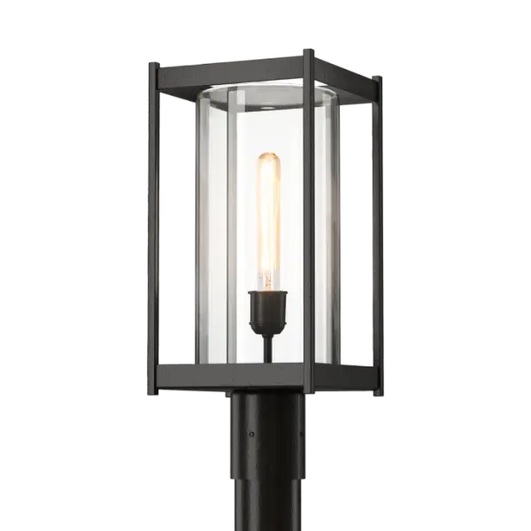 Greet guests with lighting that enhances their safe footing with functional outdoor lighting. The Cela Outdoor Post Light is a contemporary re-design of a classic lantern. A strong, geometric aluminum frame holds a well-proportaioned cylinder of blown glass within. A great first impression, and for garden or recreational pathways, the Cela will provide light that is both protective and welcoming. Available in 6 Coastal Outdoor Finishes.