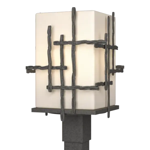 Greet your guests in style with the modern, yet organic-looking exterior lighting design of the Tura Outdoor Post Light. A warm welcome, whether along an approaching drive, walking path, poolside or to illuminate other recreational spaces, having the right exterior lighting is key to a safe and secure way to enjoy the outdoors. Hand-hammered, annealed aluminum pieces intersect at perpendicular angles to create this stylish post light made by artisans in Vermont.