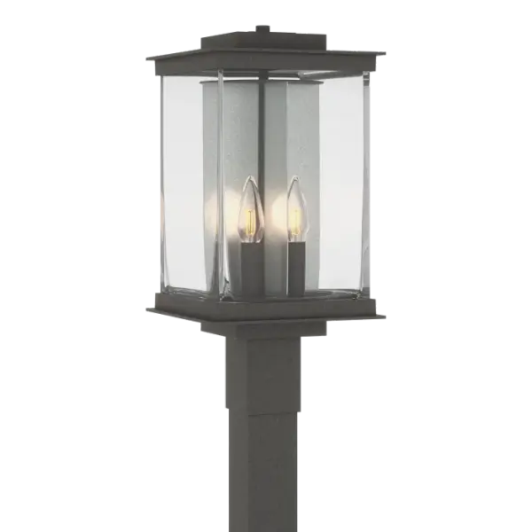 The Kingston Outdoor Post Light, part of the 2021 Kingston Outdoor Collection, will light driveways and paths, extending a warm greeting to all, for a great first impression. The Kingston Collection blends crisp architectural elements and candelabra lighting with a large rectangular blown glass that forms a versatile look on numerous home styles. This difficult to produce glass highlights the organic nature that clear glass can have with its subtle variations of thickness and patterns. The accent reflector plate behind each candelabra adds both a traditional element and a splash of contrast as it is available in our Vintage Platinum and Soft Gold finishes. Also available in hanging lantern and wall sconce designs.