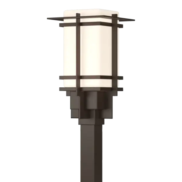 Although the design is in honor of traditional Japanese stone lanterns, our Tourou Outdoor fixture is much easier to post-mount outside home or business. Metals bands crisscross and hug the square glass tube for design flare.
