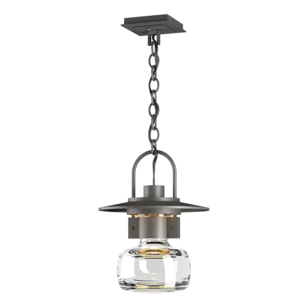 Our version of a traditional lantern gives a subtle nod to steampunk aesthetics. Showing a mix of high-end craftsmanship, from the thick blown-glass bell to the metallic curve of the lantern handle, to the details of the riveted collar – this fixture has it all.