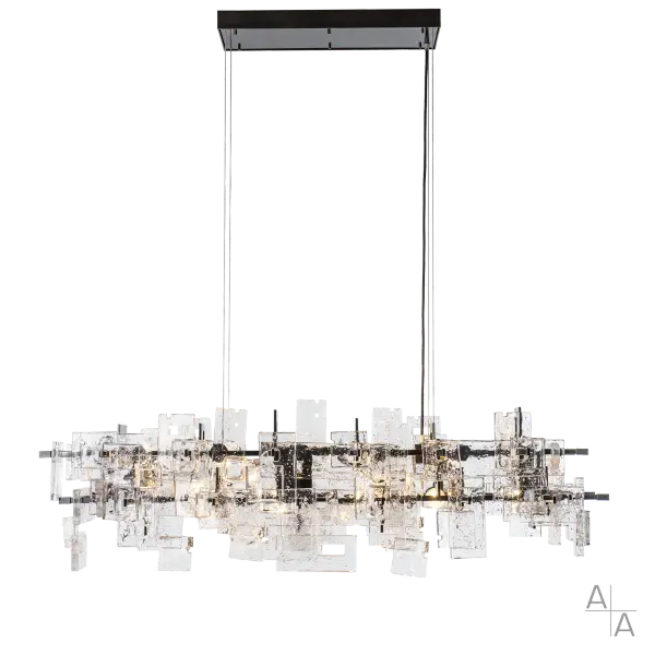 By popular demand, our designers, engineers, and makers put their heads together to create a smaller version of our Fusion Large Pendant. Approximately 43% smaller, this Fusion Pendant is perfect for most dining spaces. At first glance, it seems to be all about that glass—thick, clear, seeded, geometric "slabs" of fused glass adorn this statement piece. Then, you notice its intersecting metalwork that serves as more than a skeleton for the pendant. This modern Fusion Pendant exudes contemporary style. - alternate view