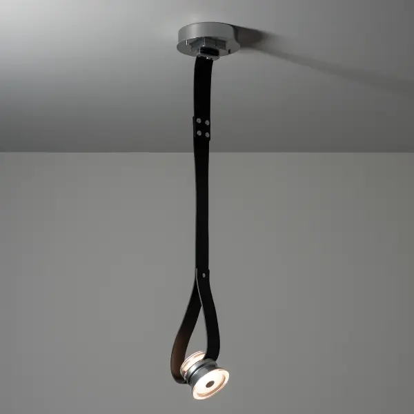 The SNAPS Single LED 45º Pendant with Metal Cone features a sensuous "looped" end with a clear, thick shaped glass that is embraced by a cone-shaped short metal housing. The two (top/bottom) LED components are diffused by an inner "puck", with the 45º outward-facing glass being frosted in the center creating beautiful, functional lighting. The fine grain leather strapping is offered in a choice of 3 standard colors. Custom color options are available.