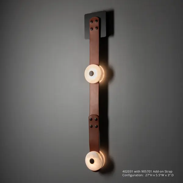 Part of the ART + ALCHEMY by Hubbardton Forge Collection, the SNAPS LED Sconce features a single alabaster-LED module with a fine leather strap and small, square steel wall mount. Designed by HF's Andy Morter, the white alabaster stone's translucence brings to light its natural variances and exquisite beauty.