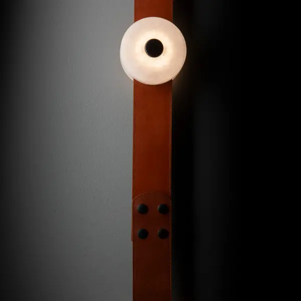 Part of the ART + ALCHEMY by Hubbardton Forge Collection, the SNAPS LED Sconce features a single alabaster-LED module with a fine leather strap and small, square steel wall mount. Designed by HF's Andy Morter, the white alabaster stone's translucence brings to light its natural variances and exquisite beauty. - alternate view