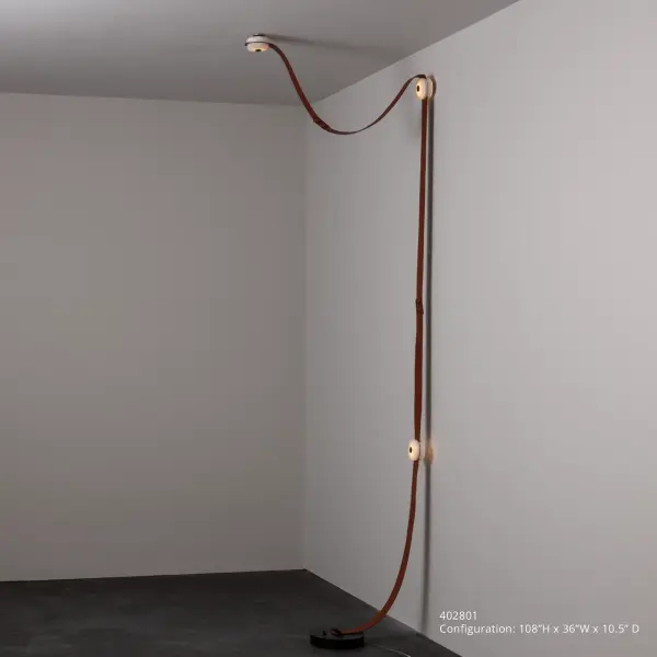 "There's just something inherently cool about snaps and leather" is how it all started for HF designer Andy Morter. Using a combination of fine leather, alabaster stone and metal, he adds hidden LED technology to create this SNAPS piece with the added versatility of being a floor plug-in for spaces without an electrical box. This portable SNAPS can be swagged over a piece of furniture, and can easily be extended, as needed beyond its two large and one shorter leather straps with optional additional elements. NOTE: Alabaster is a natural, soft stone with an element of translucency. Each piece is unique. Unleash your creativity by ordering one of these extension pieces: 905700, 905701, 905712, 905713.