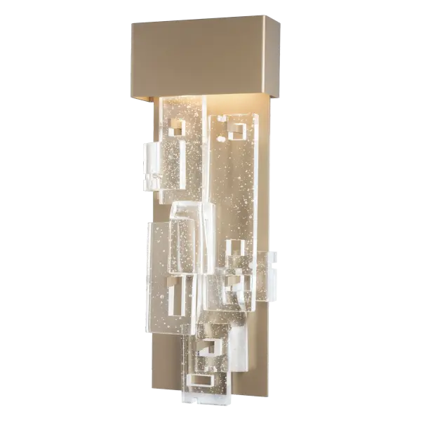 Fusion Large LED Sconce, a member of ART + ALCHEMY by Hubbardton Forge, is both elegant and functional, at over 25" in height. The staggered layers of clear, seeded, fused glass are displayed in a geometric pattern, set off by the lighting fixture's aluminum backplate. LED lighting is both economic and environmentally friendly, making for a stunning addition to any space. - alternate view
