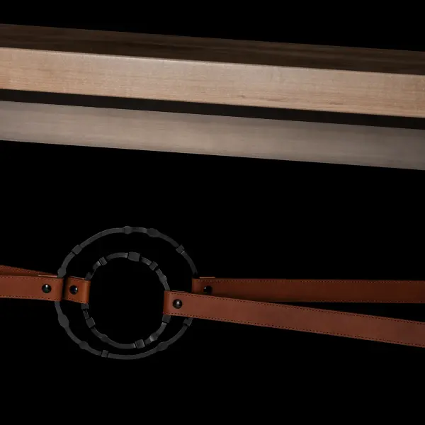Society meets glam' in the Equus design. This Equus Console Table features sophisticated details including artisanally-made leather strapping connected by hand-forged and hammered ring elements, reminiscent of martingales. Four fullered legs support a solid Vermont Maple Top that completes the richness of materials complementing the steel and leather. Available in all standard finishes.