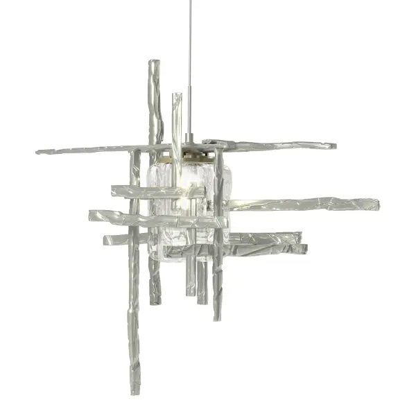 This Tura Mini Pendant is composed of perpendicular, intersecting handcrafted annealed aluminum pieces that form an exoskeleton that surround a thick, clear double layer of seeded glass. Suspended from a discrete round canopy, electricity is delivered via the pendant's low voltage cable. Available in all standard finishes.