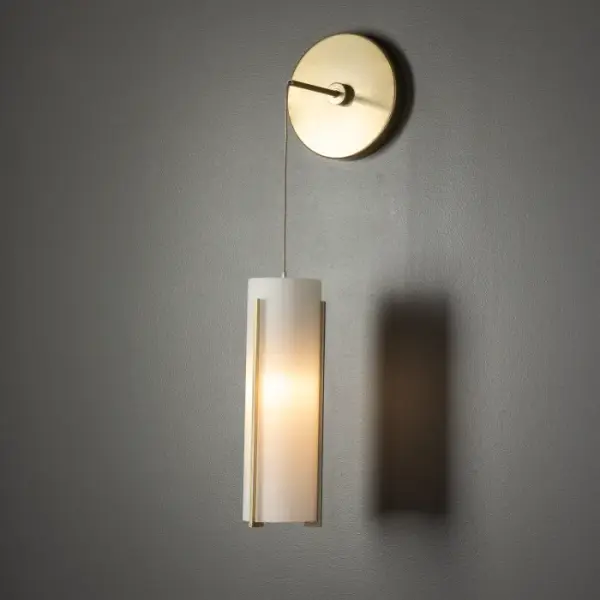 The Exos Collection pieces feature steel rods handcrafted to vertically support each shade. Glass double cylinders, with a frosted inner and a choice of clear or frosted outer glass shade offer a different feel and style for any space. You can set your own desired low voltage cable drop height for unique applications of this wall sconce, including vanity or beside, among others. - alternate view