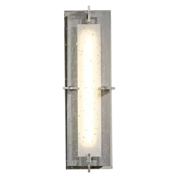 The LED concealed by opaque glass provides the illumination for our sconce. But the real shining design element is the seeded, thick glass panel. Handcrafted by artisans here at our forge in Vermont, each piece is unique.