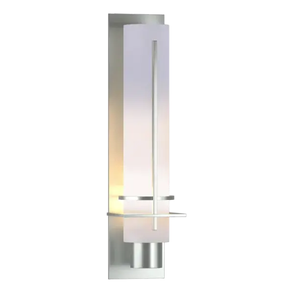 Ideal for a creating a soft mood, our After Hours Sconce has a long narrow glass tube to shield and diffuse the light. Sculpted metal bands provide visual interest. Crafted here at our Vermont forge, each piece is unique.