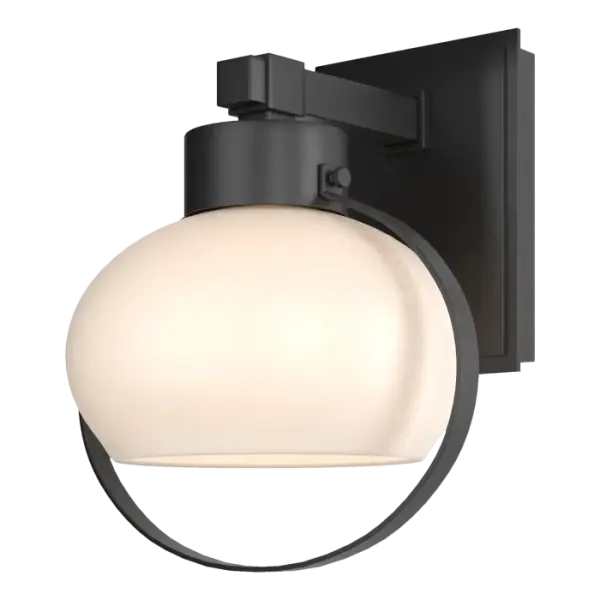 The glass of our small Port Outdoor Sconce is usually the first thing that draws the eye. But the thin, fine band hovering around it soon gets attention. Other elements like the metal bar supporting glass, band and glass diffuser also deserve attention.