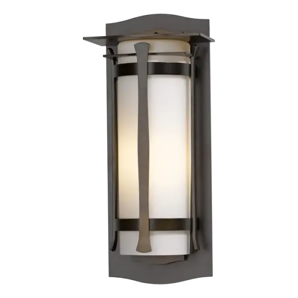 A half glass cylinder is captured within the handcrafted metal framework of our Sonora Outdoor Sconce. With just enough embellishment to be visually interesting, but not overwhelming, the Sonora provides a warm glow of welcome.