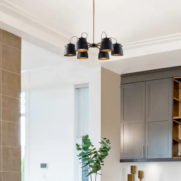 The Euro Industrial collection features matte black metal shades complimented with harvest brass nobs, hardware and rods. The interior of the metal shades is plated in a reflective black. Wire comes out of socket for an industrial look. (Other chandelier sizes and wall sconce available). 6 lite chandelier shown.