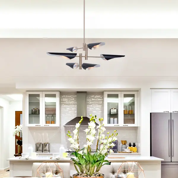 The Modern Renaissance collection is very stylish and trendy. The semi gloss black metal shades are painted in reflective white on the interior. The balance of the chandelier is plated in harvest brass. Multiple rods are included for desired height. (Also includes hang straight for sloped ceilings). 6 light model shown (4 lite also available).