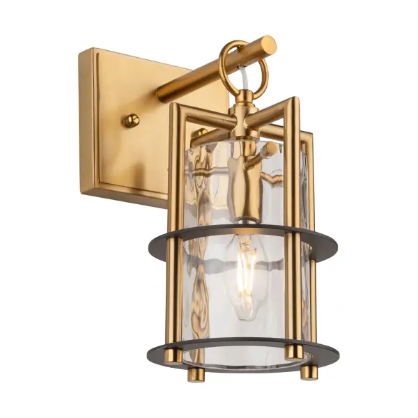 The Buford Collection is a striking ensemble that seamlessly blends elegance and modern design. Its defining features include a brass frame complimented with black rings, creating a contemporary contrast against the timeless appeal of the metal. The thick semi-transparent water glass add opulence and warmth, making these lanterns style chandeliers a sophisticated focal point for any space. Single light wall sconce shown (matching pendant, island light, and chandelier available)
