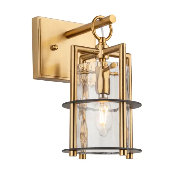 The Buford Collection is a striking ensemble that seamlessly blends elegance and modern design. Its defining features include a brass frame complimented with black rings, creating a contemporary contrast against the timeless appeal of the metal. The thick semi-transparent water glass add opulence and warmth, making these lanterns style chandeliers a sophisticated focal point for any space. Single light wall sconce shown (matching pendant, island light, and chandelier available) - alternate view