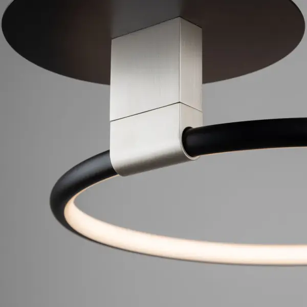 The Halo collection of semi flushmounts are all unique in their own ways. The main finish is black but has a brushed nickel holder which allows the user to rotate the LED illuminated ring. What a cool unit to place in any home. - alternate view