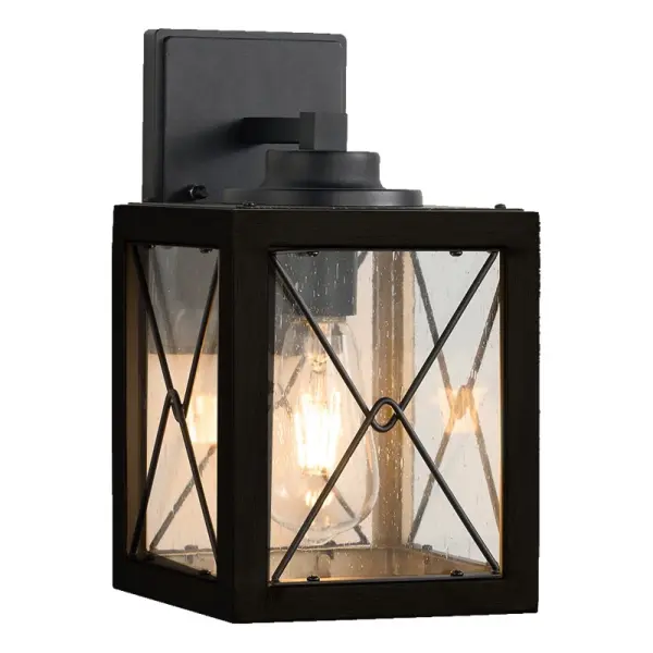 The Cameron Collection outdoor wall sconce combines timeless black metalwork with clear seeded glass, evoking the charm of classic lanterns. Its medium base socket provides a warm, inviting glo w, perfect for illumi na ting outdoor spaces. Av ailable in two sizes, this versatile sconce adds a touch of elegance and refinement to any entryway or patio.