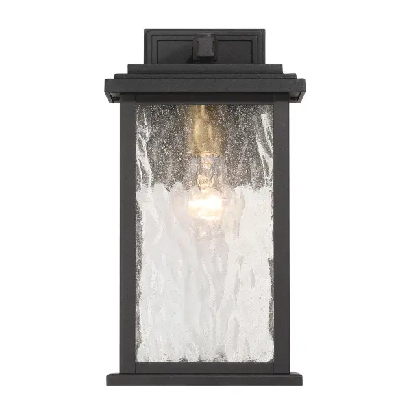 Brass with Rain Glassware The “Estate” Collection outdoor wall sconce radiates classic allure, with its black metal frame offering a striking contrast to the mesmerizing water glass panels. Encased within, vintage brass candle covers and intricate metalwork glow warmly, evoking a sense of nostalgic charm. Perfect for enhancing any outdoor space, this sconce blends classic sophistication with modern durability.