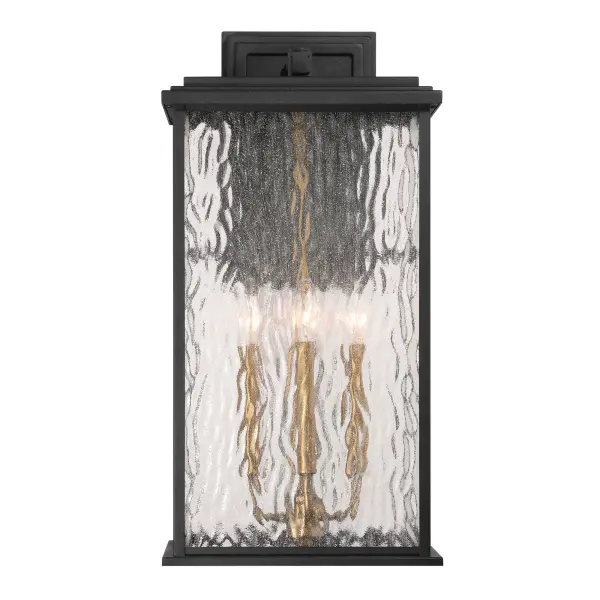 Brass with Rain Glassware The “Estate” Collection outdoor wall sconce radiates classic allure, with its black metal frame offering a striking contrast to the mesmerizing water glass panels. Encased within, vintage brass candle covers and intricate metalwork glow warmly, evoking a sense of nostalgic charm. Perfect for enhancing any outdoor space, this sconce blends classic sophistication with modern durability.