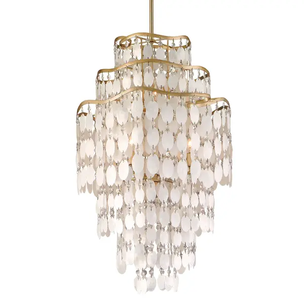 The Dolce chandelier combines hand-crafted iron with natural capiz shells and crystals for a sophisticated, organic aesthetic. Its champagne leaf finish adds warmth while the 20-inch diameter suits medium-sized spaces perfectly.