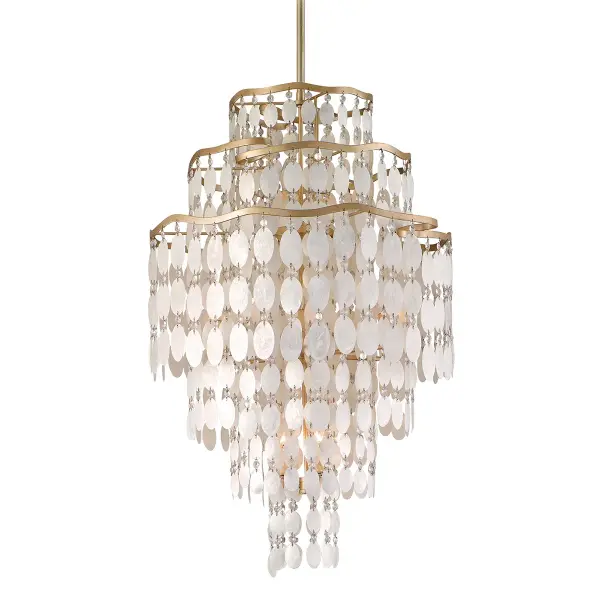 The Dolce chandelier combines hand-crafted iron with natural capiz shells and crystals for a sophisticated, organic aesthetic. Its champagne leaf finish adds warmth while the 12 lights provide ample illumination for medium-sized spaces.