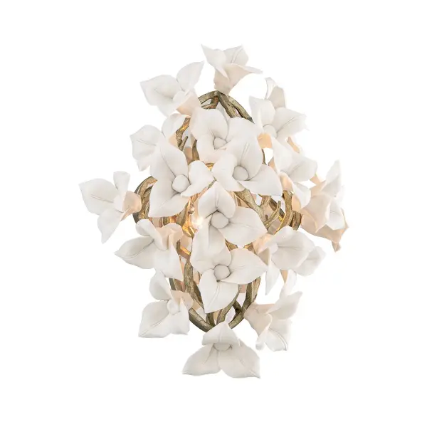 The Lily sconce brings organic beauty to any space with hand-crafted iron construction and delicate porcelain flower accents. The stria gold leaf finish adds warmth and sophistication, making it ideal for powder rooms and intimate spaces.