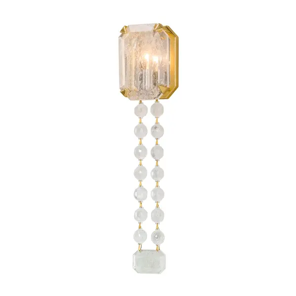 The Alibi wall sconce combines artisanal craftsmanship with contemporary elegance. Hand-worked iron in gold leaf finish pairs beautifully with Venetian glass for a refined, luxurious look that elevates any space.