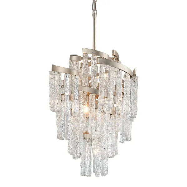The Mont Blanc chandelier combines modern silver leaf finish with hand-crafted clear Venetian glass for a sophisticated look. Its compact 18-inch width makes it versatile for smaller dining spaces while seven lights provide ample illumination.