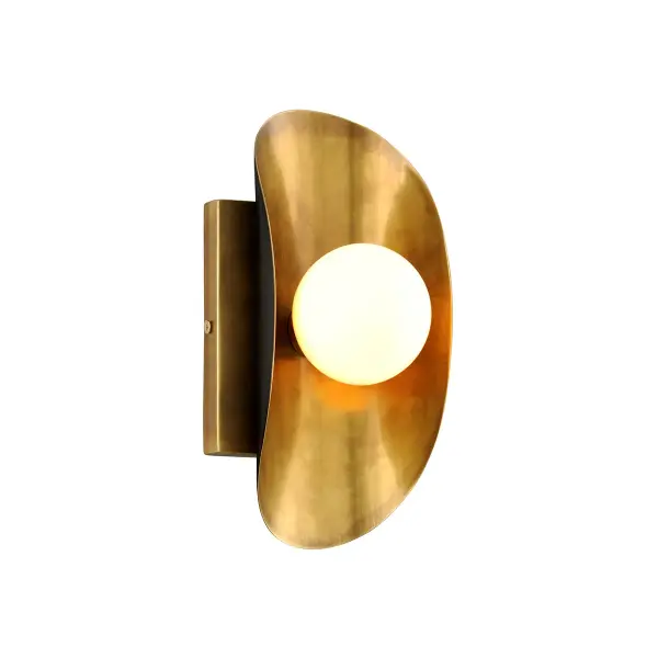 Inspired by Dennis Hopper's Hollywood Hills villa, this striking LED sconce features brass leaves with contrasting finishes—vintage brass on one side, natural black on the reverse. The white glass diffusers nestle like peas in a pod, creating a powerful blend of mid-century modernism and organic form.