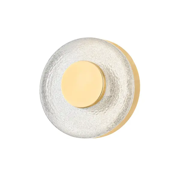 This petite LED sconce delivers sophisticated impact through its combination of thick cast glass with distinctive chill marks and warm Vintage Brass framing. The backlit design creates gorgeous refraction and texture, making it ideal for intimate spaces.