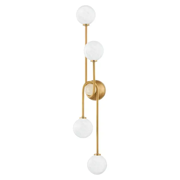 This striking vertical sconce commands attention with its 37-inch height and architectural design. Four etched cloud glass globes create a soft, diffused glow while the vintage brass finish adds warmth and sophistication to any space.