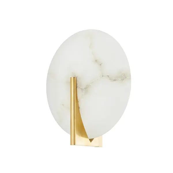 The Asteria LED sconce combines natural alabaster with vintage brass metalwork for a sophisticated, minimalist aesthetic. Its integrated LED provides warm, diffused light ideal for intimate spaces. ADA compliant and damp-rated for versatile placement.