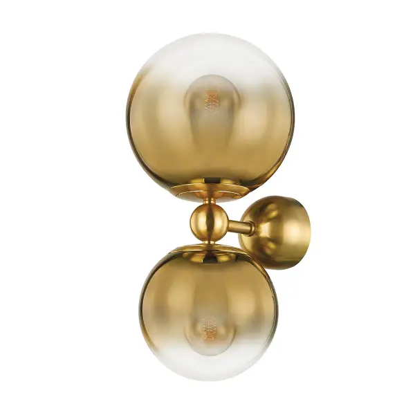 The Kyoto wall sconce is a showstopper featuring clustered ombre glass globes that transition from brass to clear. This artistic fixture delivers both ambient and decorative lighting with a sculptural presence.
