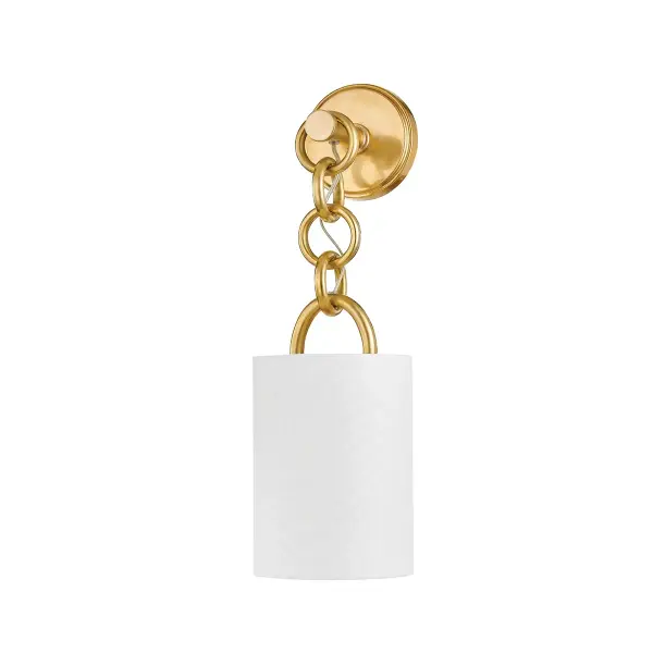 The Kansa sconce brings sophisticated glamour through its bold chain detailing and vintage brass finish. The perfectly scaled rings cascade beneath a white linen shade, creating warm ambient lighting with Art Deco flair.