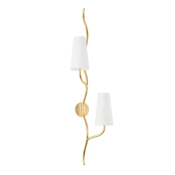 The Cortona wall sconce brings organic elegance with vine-like arms in vintage gold leaf that gracefully frame white linen shades. At 48 inches tall, this statement piece provides soft ambient lighting while serving as sculptural wall art.