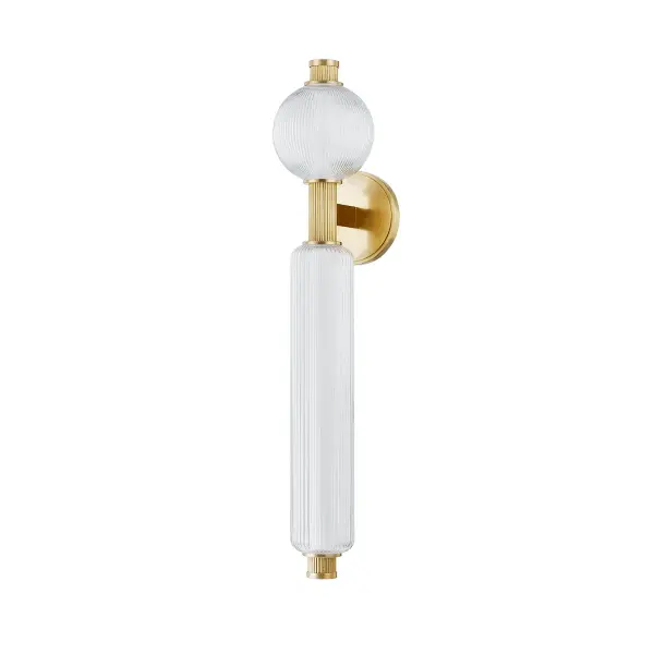 The Atom LED Wall Sconce brings iconic mid-century sputnik styling to contemporary spaces with energy-efficient integrated LEDs. Reeded brass arms and clear glass spheres create visual interest while delivering warm, high-CRI illumination.