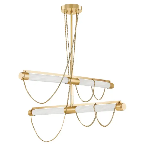 The Lariat LED Chandelier combines architectural elegance with organic beauty. Tubular alabaster shades suspended by jewelry-like chains create dramatic visual interest, while knurled metalwork adds refined detail. Designer Noz Nozawa's Roman-inspired design balances clean lines with fluid movement.